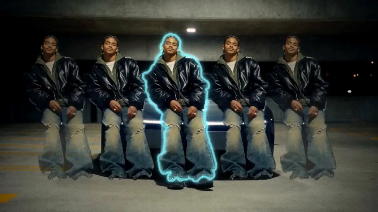 Dax Rowe, an AI character in a black leather bomber over a green hoodie and baggy jeans, performing on a night street, in a parking garage and in a hotel hallway, with a white outline and a cyan glow around him, clones stepping out beside him and the word OFF big behind him