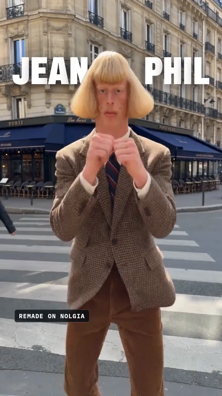 The reel, part one: Jean Phil shadowboxing on a Paris street with his name around him, his view count rolling to 77 million, then the host on a Paris rooftop asking what he is selling while he shadowboxes behind her