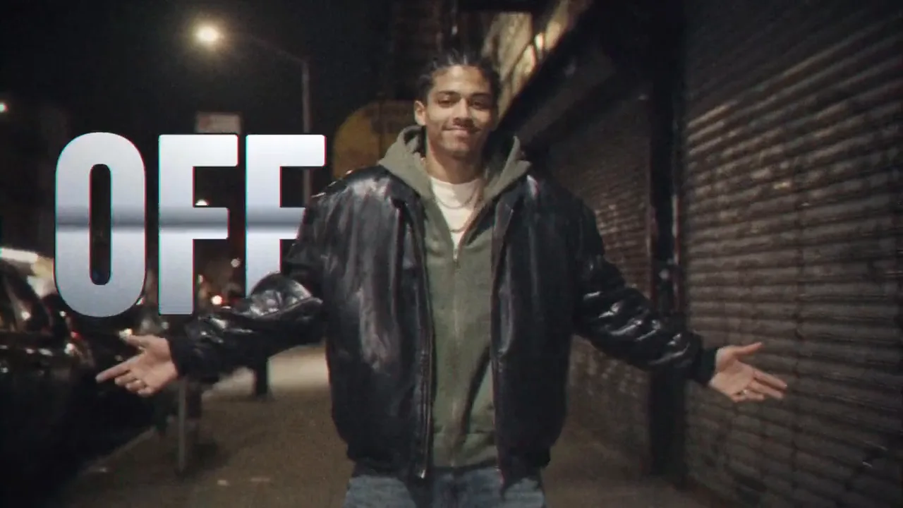 The same cut played back as VHS: warm film burns over the night street, the chrome word OFF behind Dax as he opens his arms, static at the cuts, and Dax walking away from a grey concept car in the parking garage